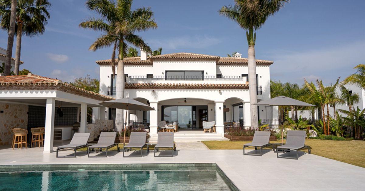 What is the process for buying real estate in Spain?